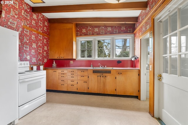 kitchen featuring white appliances, light colored carpet, and beamed ceiling