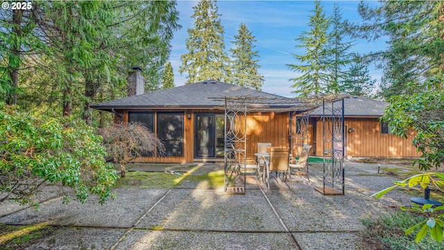 view of patio / terrace with a sunroom