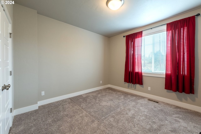 unfurnished room featuring carpet flooring