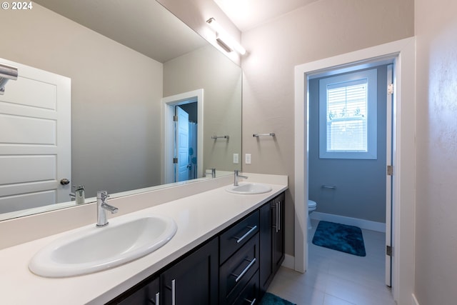 bathroom with vanity and toilet