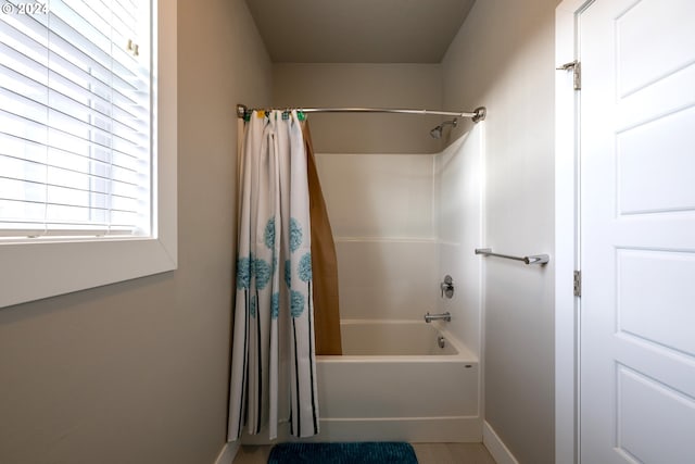 bathroom featuring shower / bath combo with shower curtain