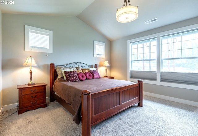 carpeted bedroom featuring lofted ceiling