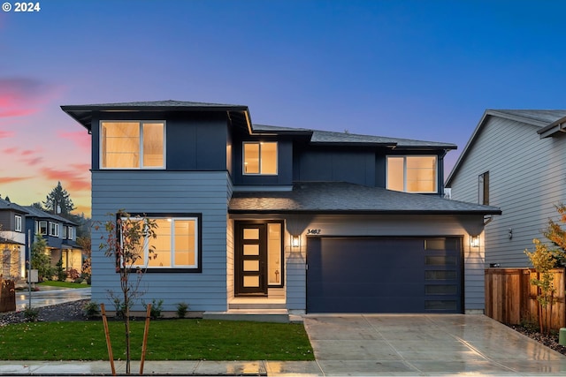 view of front of house with a lawn and a garage