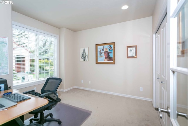 office space featuring light carpet, baseboards, and recessed lighting