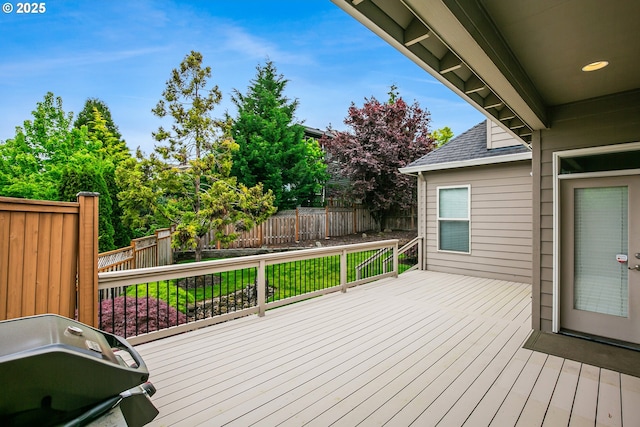 wooden deck featuring fence and area for grilling