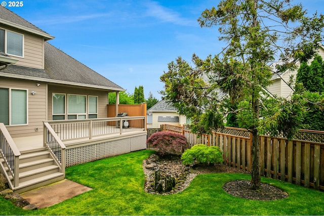 view of yard with a wooden deck