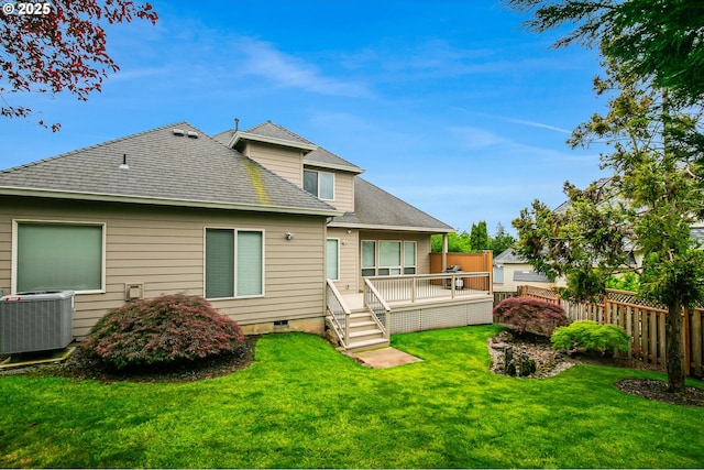 rear view of property with central AC, a deck, and roof with shingles