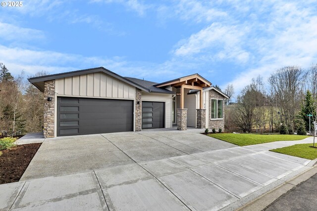 view of front of house with a garage and a front lawn