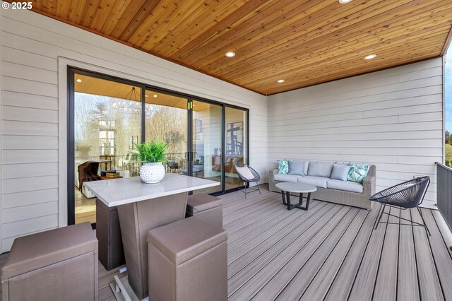 wooden deck with outdoor lounge area