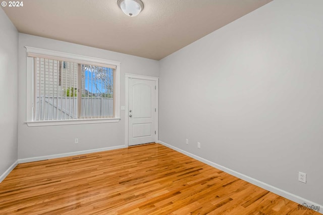 unfurnished room featuring light hardwood / wood-style flooring