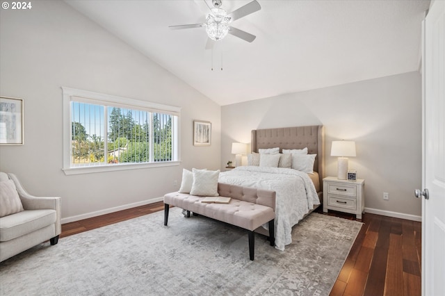 bedroom featuring dark hardwood / wood-style flooring, vaulted ceiling, and ceiling fan