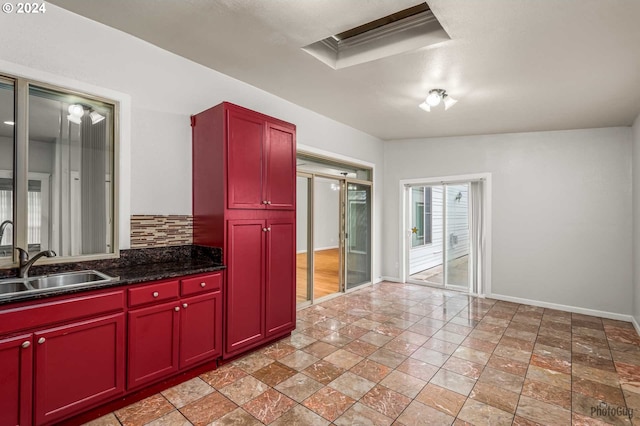 kitchen featuring tasteful backsplash and sink