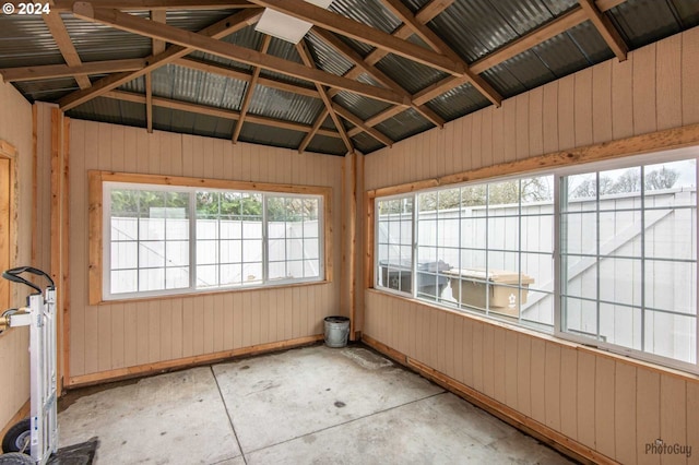 unfurnished sunroom with vaulted ceiling