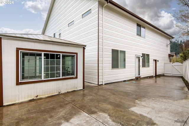 view of side of home featuring a patio