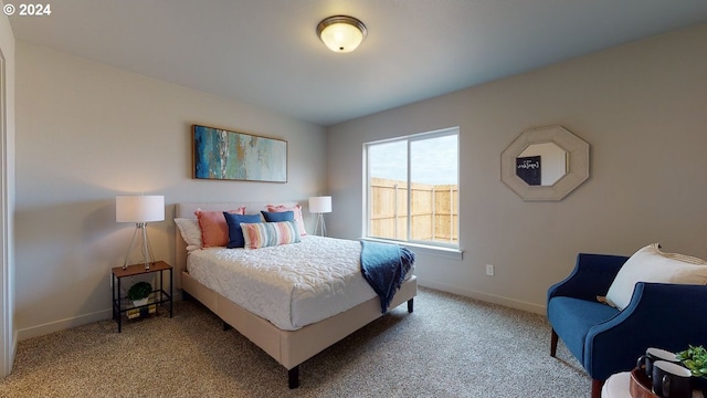 bedroom featuring light colored carpet