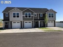 townhome / multi-family property with a garage