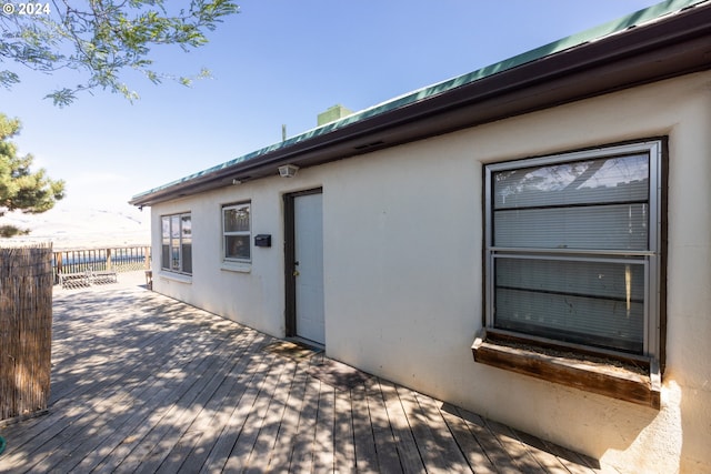 view of side of property featuring a deck