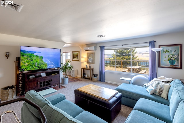 carpeted living room with plenty of natural light and a wall mounted AC