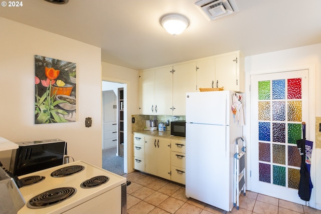 kitchen featuring white cabinetry, backsplash, white appliances, and light tile patterned flooring