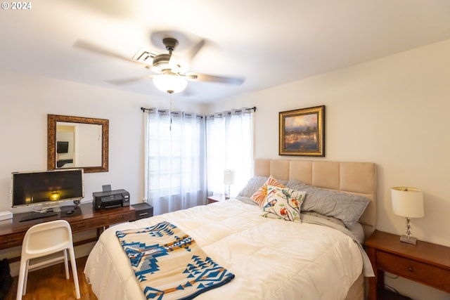 bedroom featuring ceiling fan and wood-type flooring