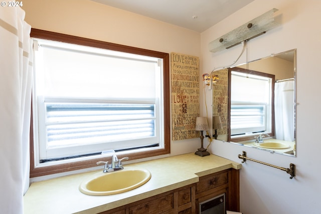 bathroom with vanity and a healthy amount of sunlight