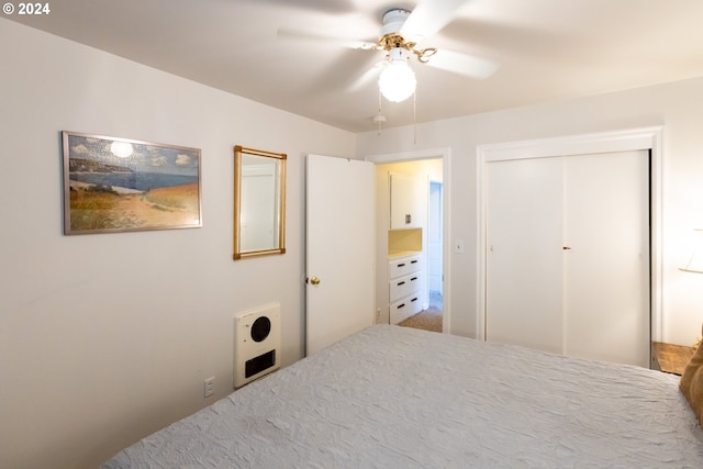 bedroom with ceiling fan and a closet