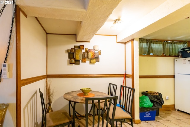 dining space featuring light tile patterned flooring