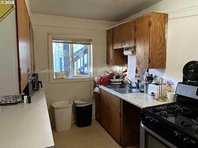 kitchen with sink and range with gas cooktop