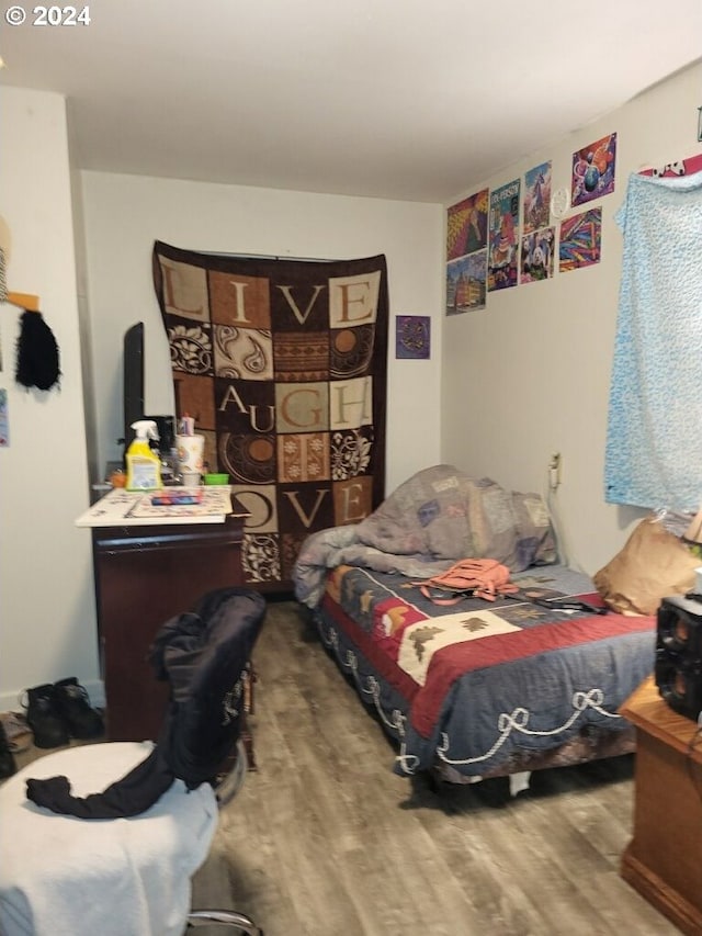 bedroom featuring hardwood / wood-style flooring