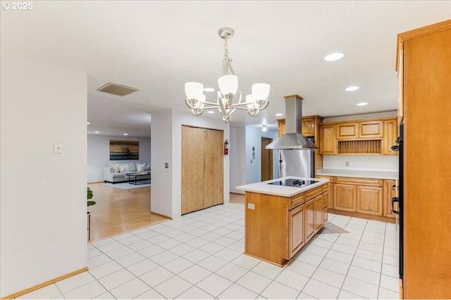 kitchen with black electric stovetop, island exhaust hood, light tile patterned floors, a kitchen island, and pendant lighting