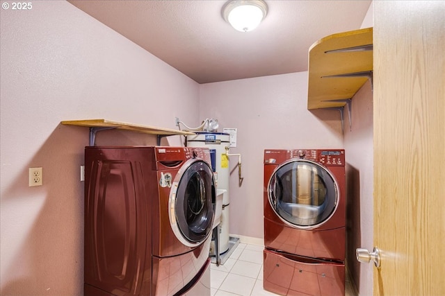 laundry area featuring light tile patterned floors and independent washer and dryer