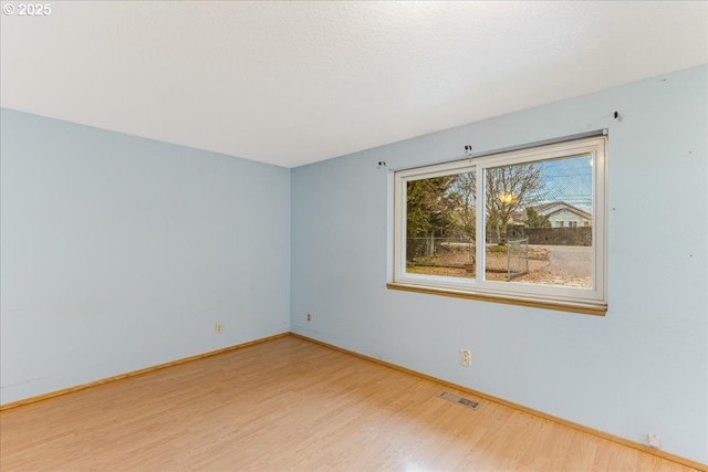 empty room featuring hardwood / wood-style floors