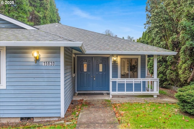 doorway to property featuring a porch