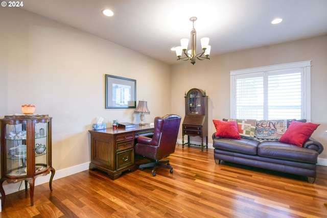 home office with a chandelier and wood-type flooring