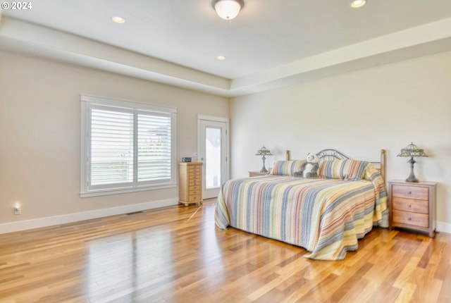 bedroom with light hardwood / wood-style floors