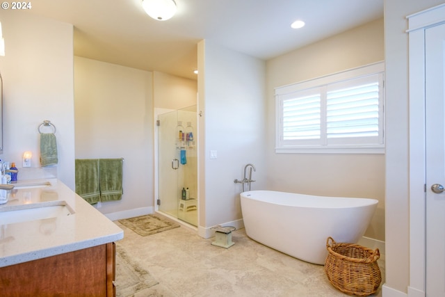 bathroom with independent shower and bath, tile floors, and double sink vanity