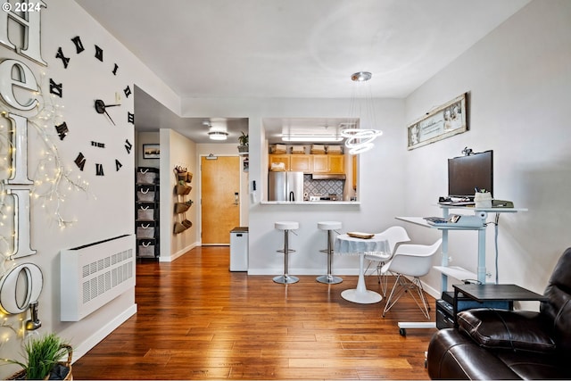 interior space featuring hardwood / wood-style flooring and heating unit