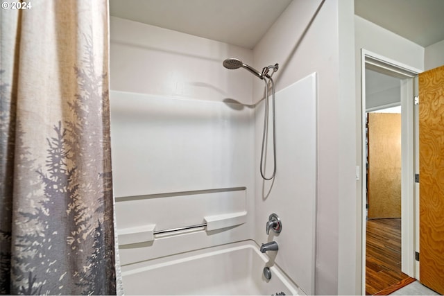 bathroom featuring shower / tub combo with curtain