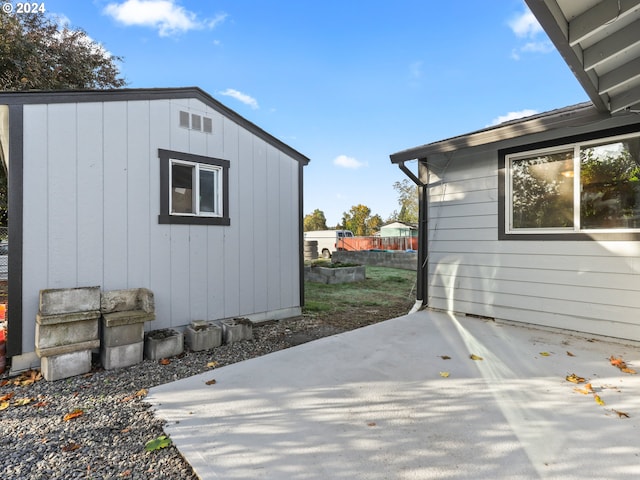 view of side of property with a patio area