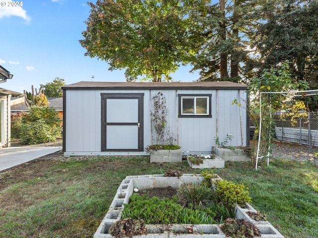 view of outbuilding with a lawn