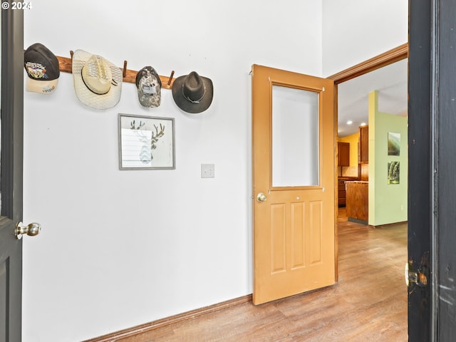 corridor with light wood-type flooring