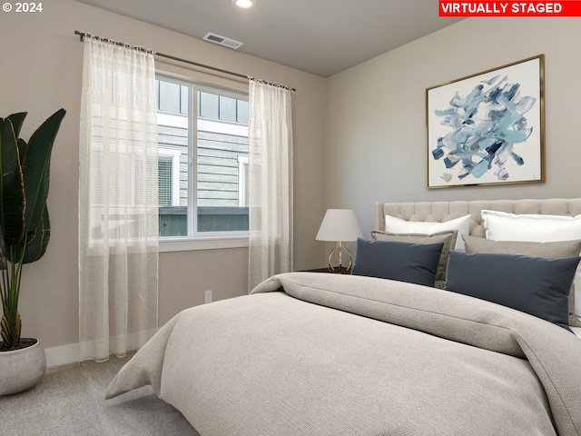 bedroom featuring carpet