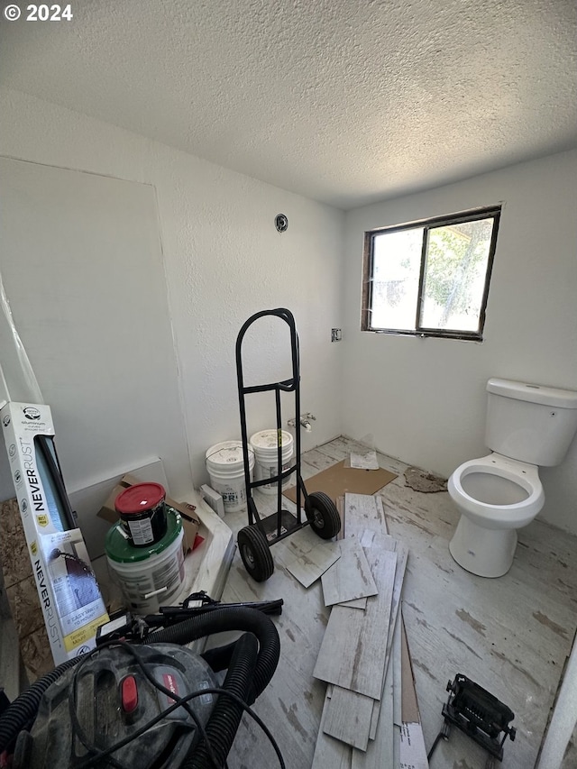 bathroom with a textured ceiling