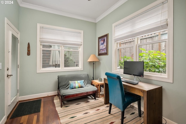 home office featuring ornamental molding and light hardwood / wood-style floors