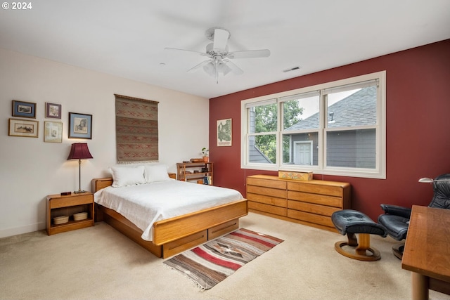 bedroom featuring ceiling fan and light carpet