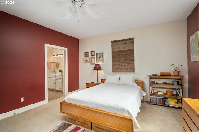 carpeted bedroom featuring sink, connected bathroom, and ceiling fan