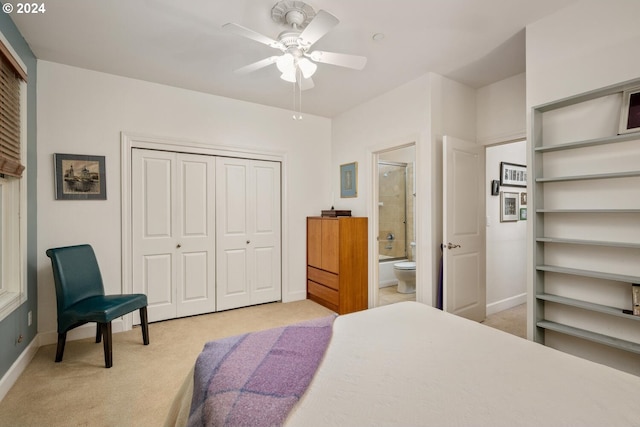 bedroom featuring a closet, ceiling fan, and light carpet