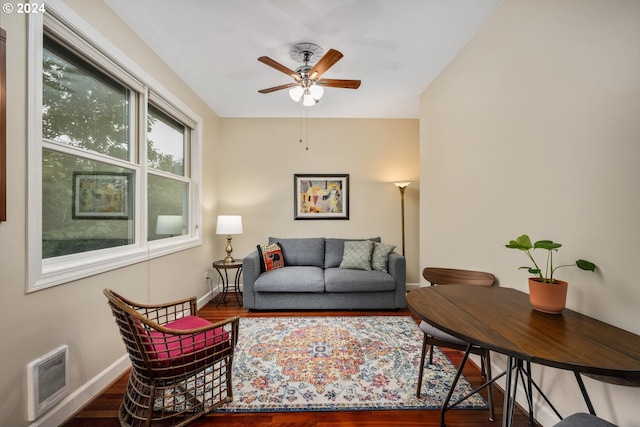 living room with ceiling fan and hardwood / wood-style floors