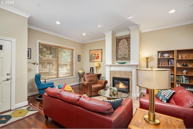 living room featuring a fireplace, crown molding, and dark hardwood / wood-style floors