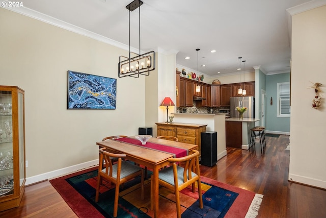 dining space featuring a notable chandelier, dark hardwood / wood-style flooring, and crown molding